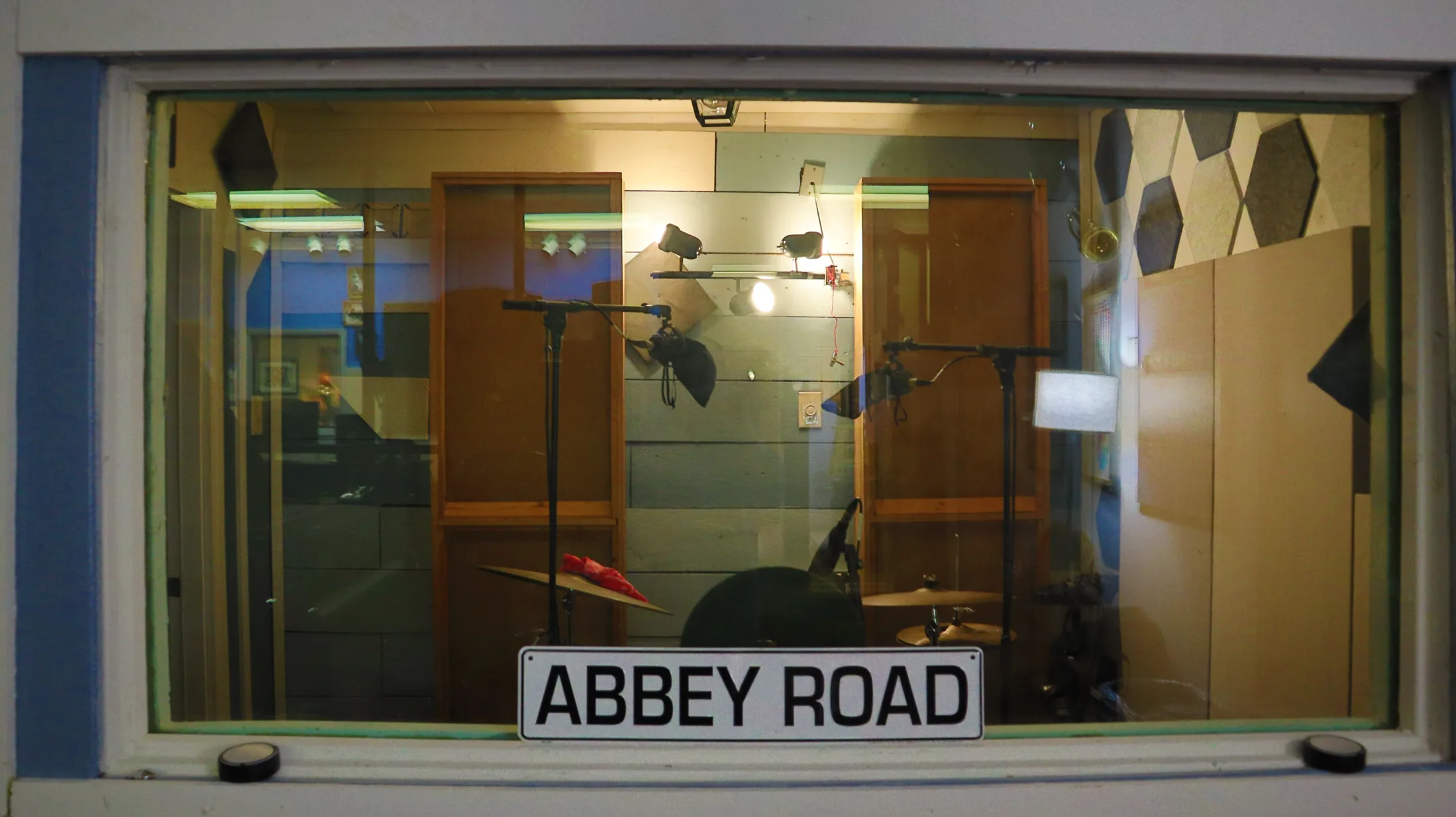 The same drum and isolation booth viewed from the control room